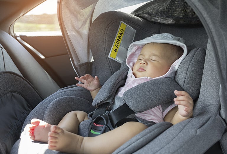 Where in the car should the child seat be installed?
